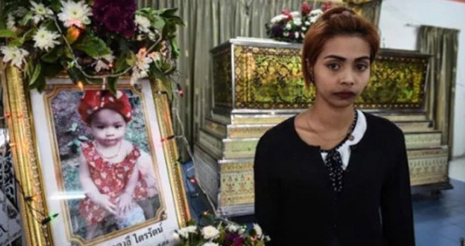 Jiranuch Trirat dan foto kenangan Natalie. Foto: AFP