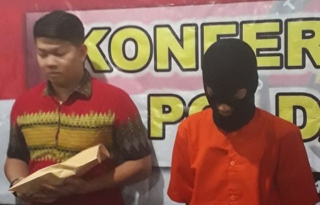 Pelaku saat diamankan di Polda Jambi