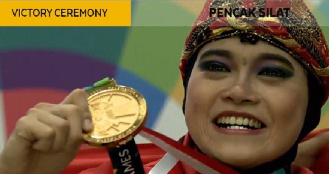 Puspa Arumsari meraih emas pertama dari cabor pencak silat, Senin (27/8/2018). (badmintontalk)