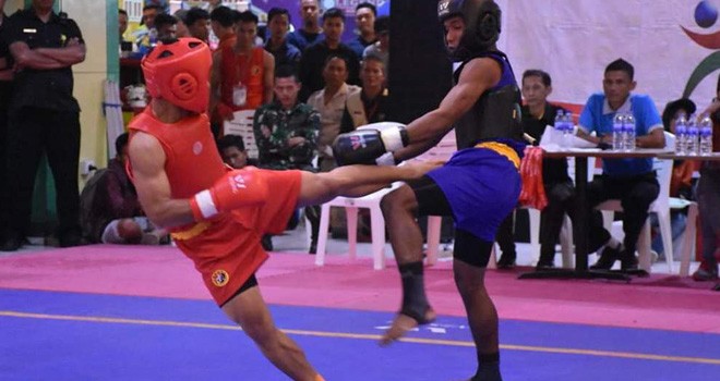 Atlet wushu kota jambi saat melakoni lomba di salah satu nomor Sanda.